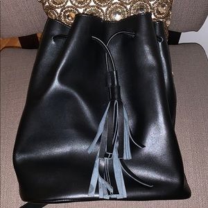 N. M. black leather drawstring backpack purse
